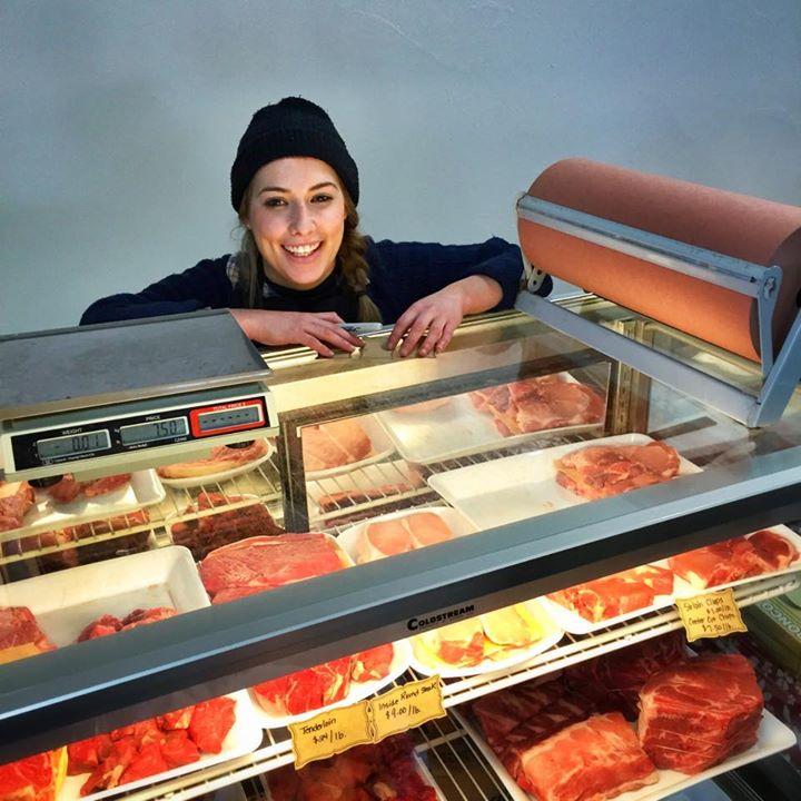 Brianna Hagell offers local meat at the Alderney Market. (Photo by Doug Townsend) 