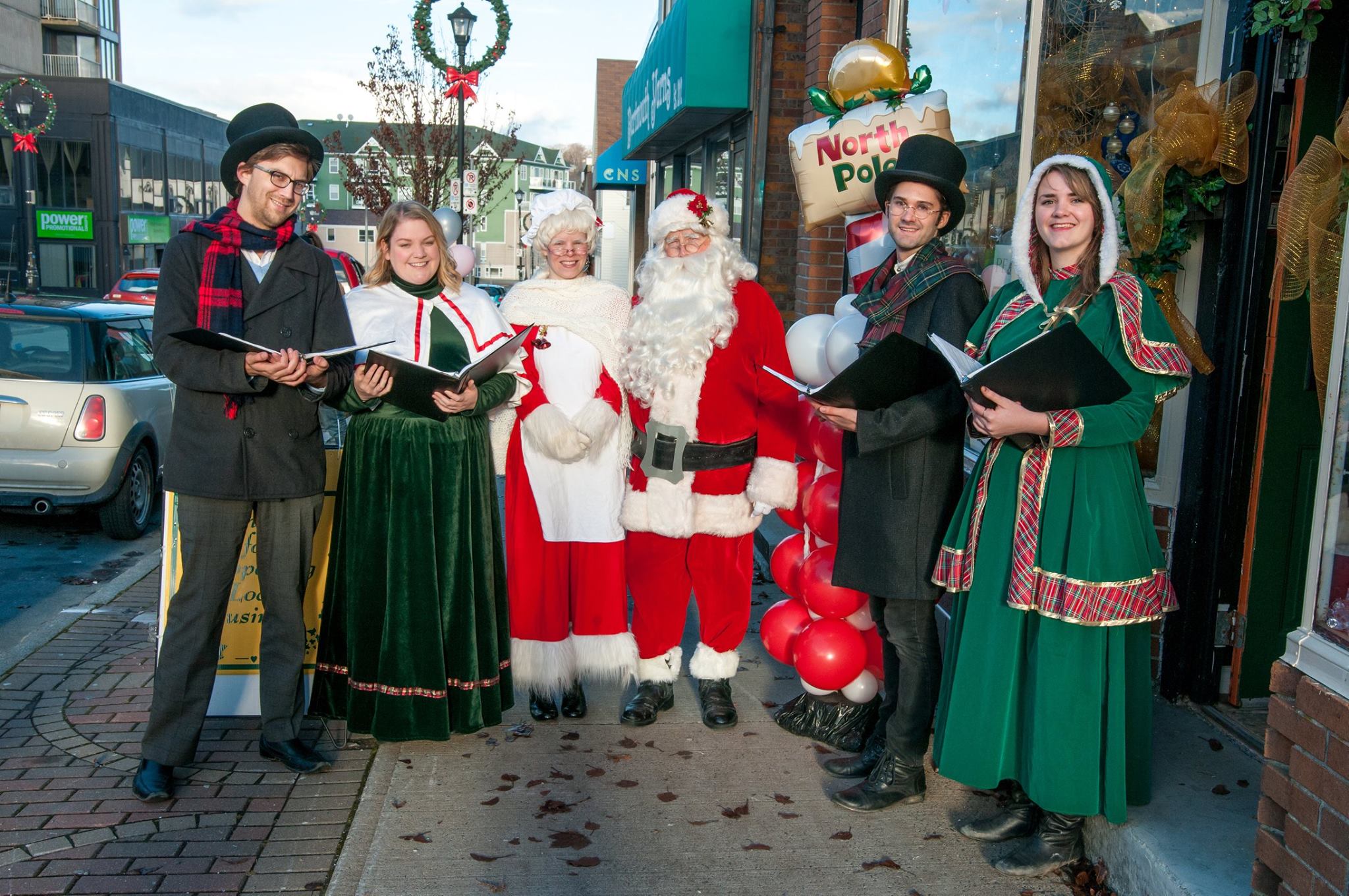 Michael Robson (2nd from the right)  making music with the East Coast Carollers in Downtown Dartmouth. (Photo credit: Jennifer Delorey Nextgen/DDBC)
